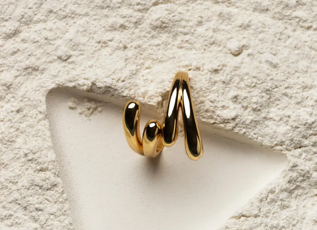 expensive golden ring with white powder background 23 2150347040 copy
